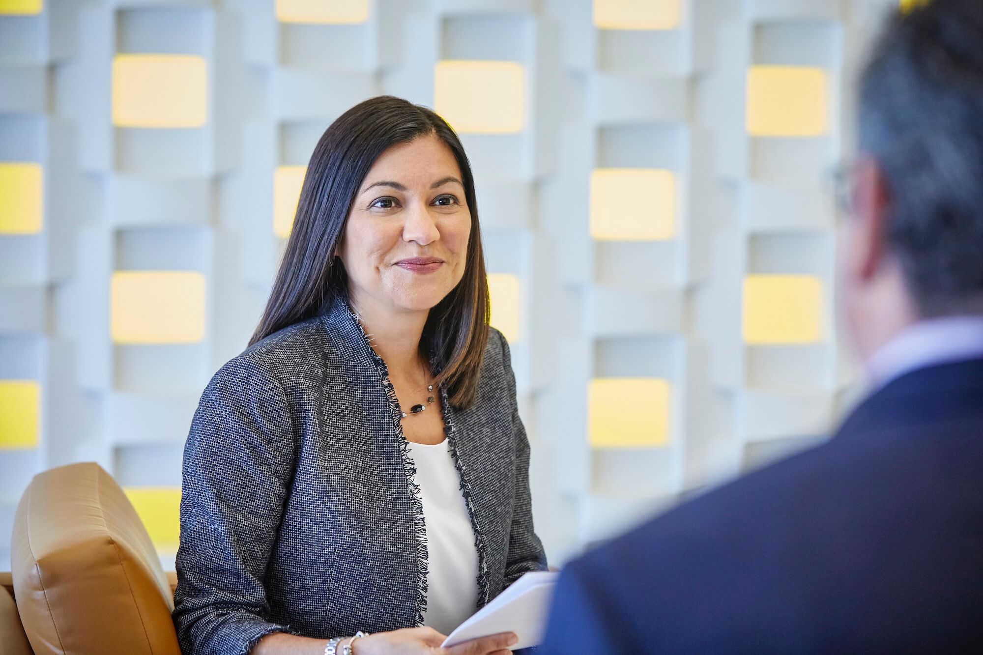 woman and man in office having a conversation